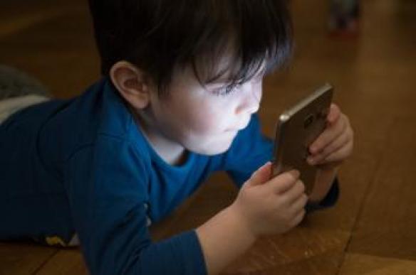 Child looking at mobile